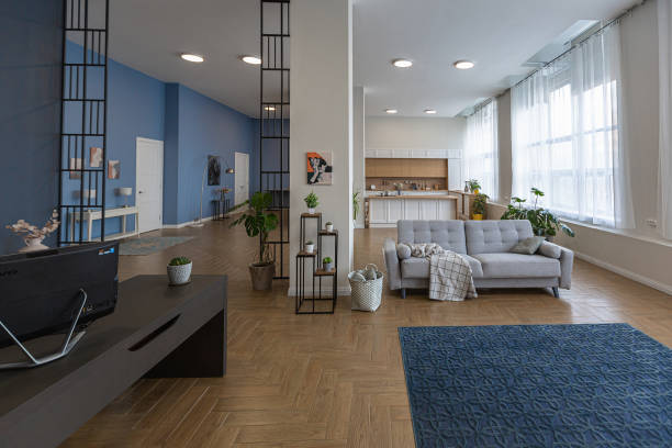 istock minimalist modern interior design huge bright apartment with an open plan in Scandinavian style in white, blue and dark blue colors with columns in the center. includes kitchen area, office and lounge 1397509982