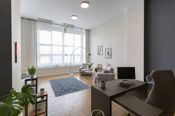 istock minimalist modern interior design huge bright apartment with an open plan in Scandinavian style in white, blue and dark blue colors with columns in the center. includes kitchen area, office and lounge 1397510054