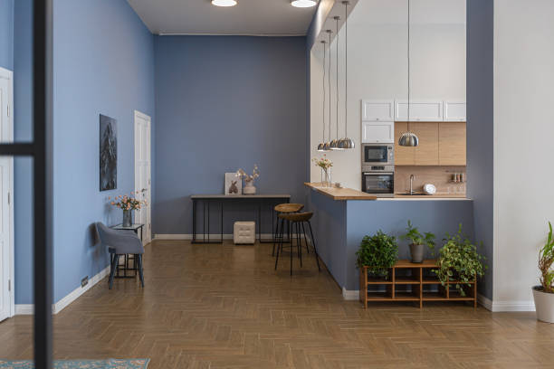 istock minimalist modern interior design huge bright apartment with an open plan in Scandinavian style in white, blue and dark blue colors with columns in the center. includes kitchen area, office and lounge 1397510164