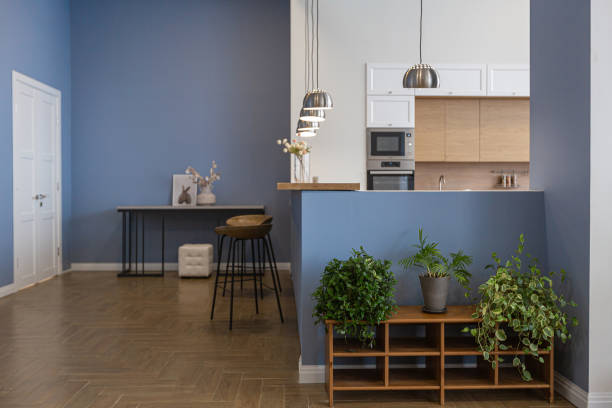 istock minimalist modern interior design huge bright apartment with an open plan in Scandinavian style in white, blue and dark blue colors with columns in the center. includes kitchen area, office and lounge 1397510176