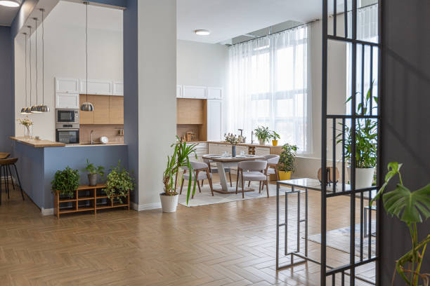 istock minimalist modern interior design huge bright apartment with an open plan in Scandinavian style in white, blue and dark blue colors with columns in the center. includes kitchen area, office and lounge 1397510225