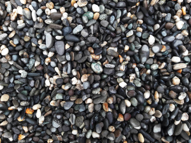 istock boulder pebble beach stones background seamless texture for design use, Naturally rounded gravel at sea shore Nature background texture pattern 1397510379