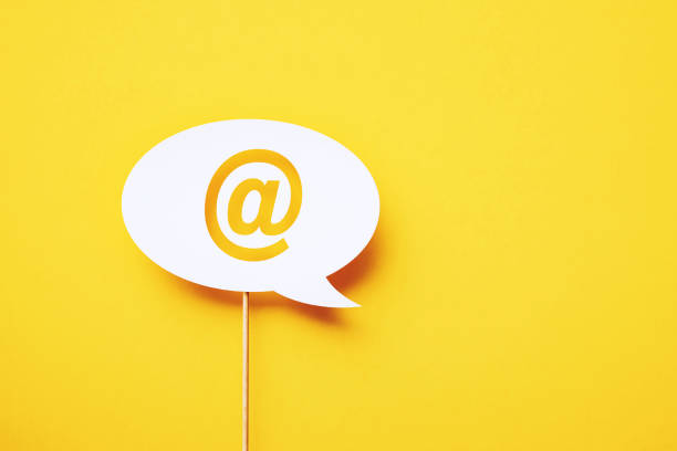 istock At Symbol Written Circular White Chat Bubble Sitting On Yellow Background 1397510515