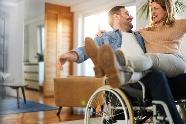 istock Happy disabled man having fun with his girlfriend at home. 1397510831