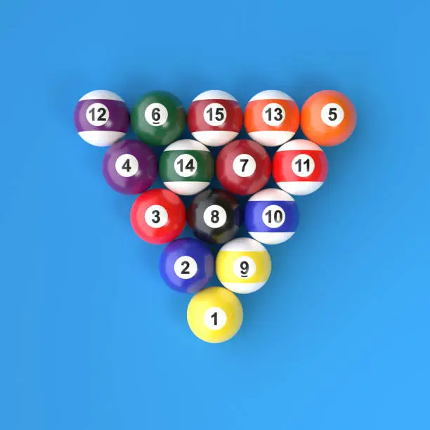 Photo of A group of colorful glossy billiard balls with numbers on a blue billiard table