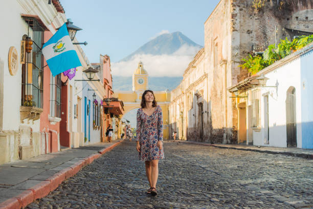 Young Caucasian woman in dress walking in Antigua, Guatemala