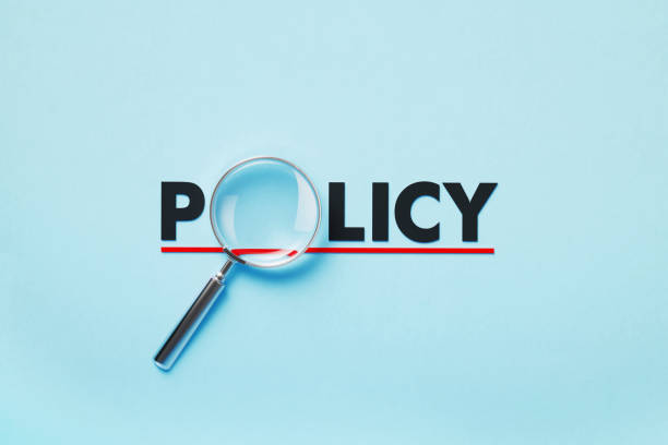 istock Magnifier Forming Policy Word On Blue Background 1397511803