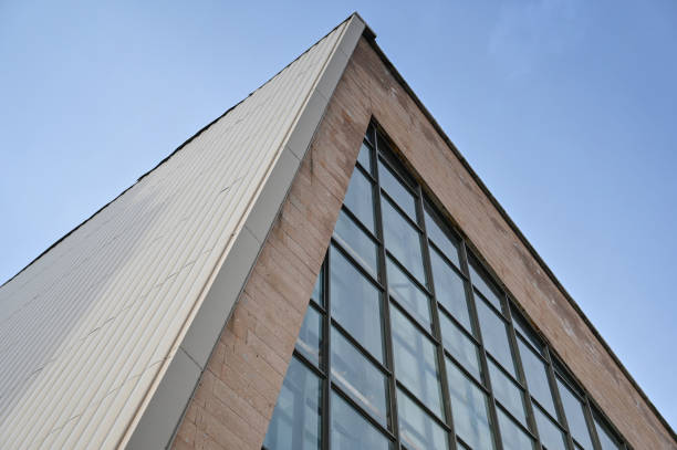 istock Geometric composition of glass and concrete against a blue cloudless sky. 1397514004