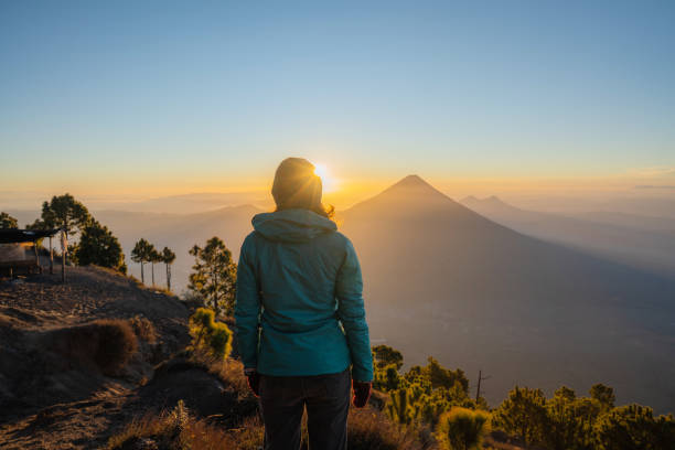 Woman standing on the background of   volcano in Guatemala stock photo