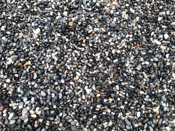 istock boulder pebble beach stones background seamless texture for design use, Naturally rounded gravel at sea shore Nature background texture pattern 1397514400