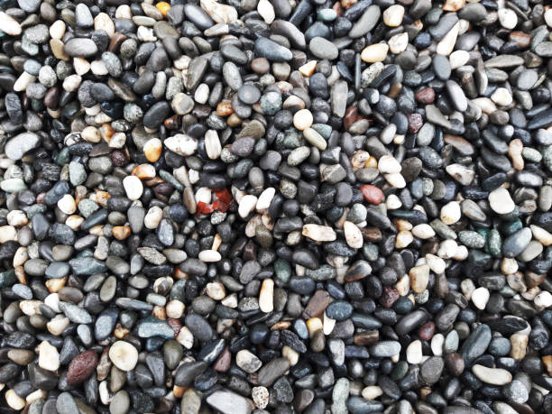 istock boulder pebble beach stones background seamless texture for design use, Naturally rounded gravel at sea shore Nature background texture pattern 1397514589