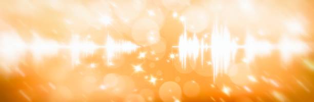 istock lens flare and particle background with audio waveform 1397515617