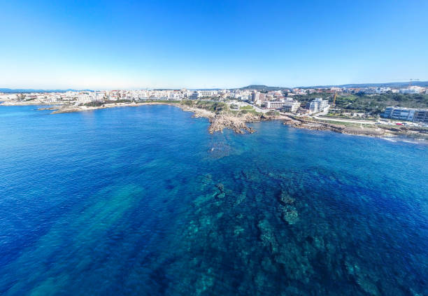 istock Aerial view of Alghero coastline under a blue sky 1397515849