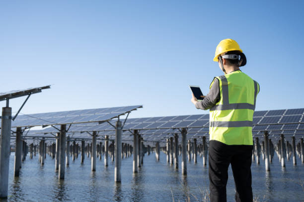 istock Female technician at solar power plant 1397515851