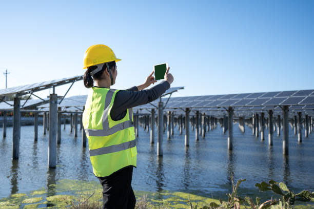 istock Female technician at solar power plant 1397515912