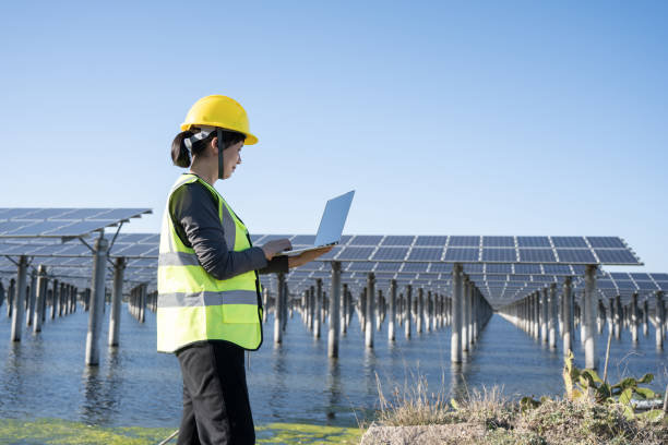 istock Checking the operation of the solar power station solar panel system with a laptop 1397515955