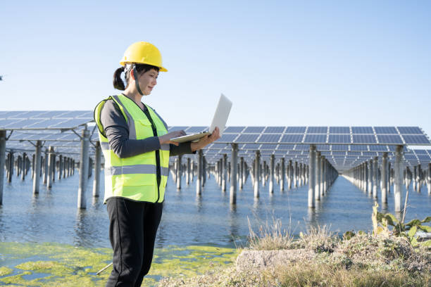 istock Checking the operation of the solar power station solar panel system with a laptop 1397515957