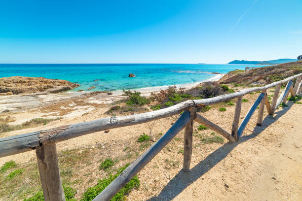 Sun shining over Scoglio di Peppino beach in springtime. Sardinia, Italy