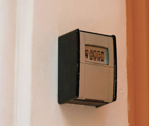 istock Smart key lock mounted on a wall or door frame for renting apartment. Safe Key Box is used when the guest arrives at the touristic flat and the host can't open the door. Safe access to living space. 1397521418