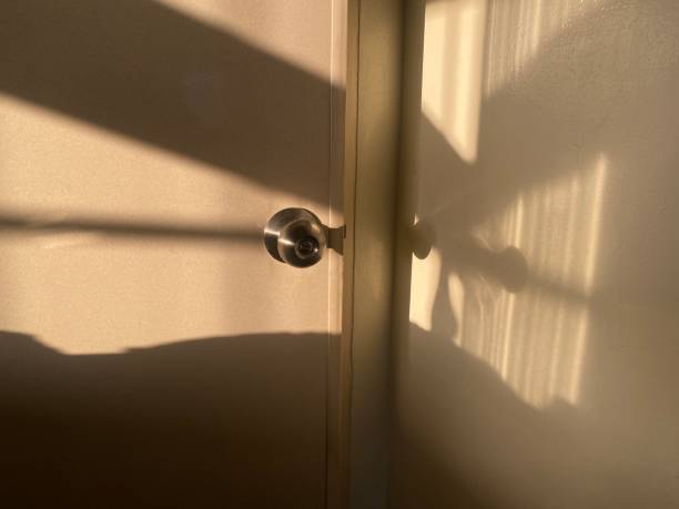istock Sunlight and Shadow Reflect on the Doorknob 1397522712