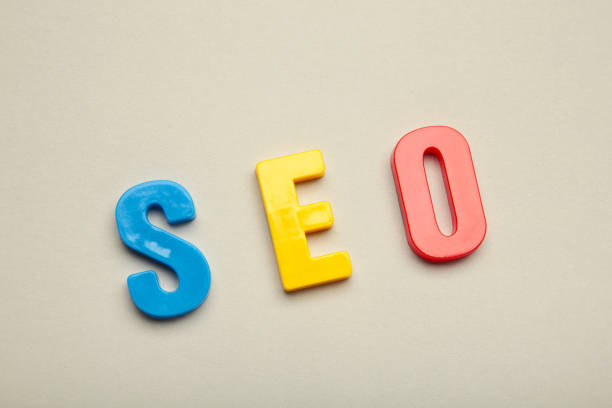 istock Wooden letters with SEO spelling letters on grey background. 1397525001