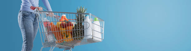 istock Woman pushing a full shopping cart 1397527064