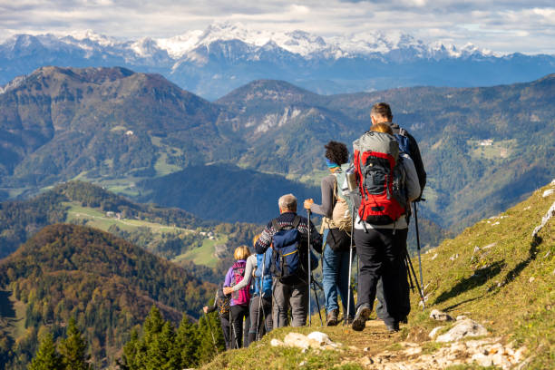 istock Group of people hiking in mountains 1397527180
