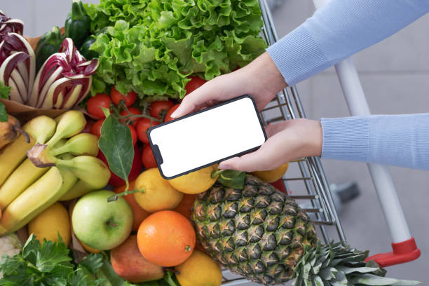 istock Woman buying fresh greens and using her smartphone 1397527291