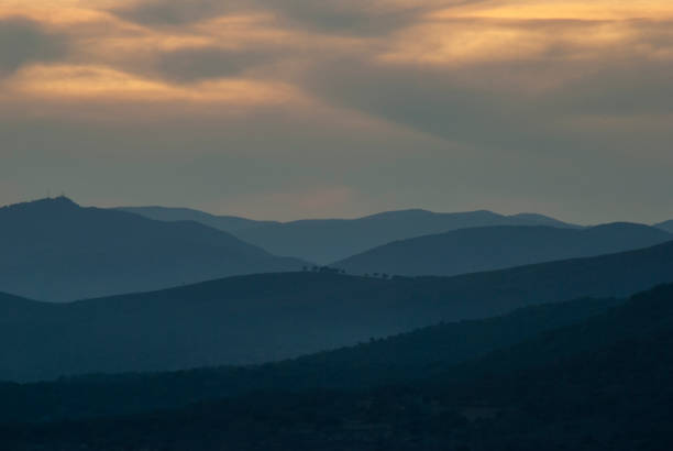 istock Mountains at sunset in blue hour with cool toned clouds 1397529118