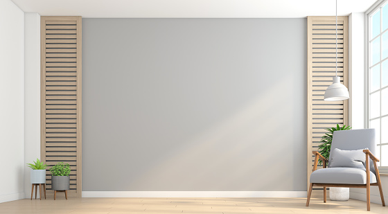 Empty minimalist room with armchair and gray wall.3d rendering