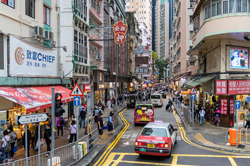 Hong Kong - May 16, 2022 : People at the Wan Chai Road in Wan Chai, Hong Kong.