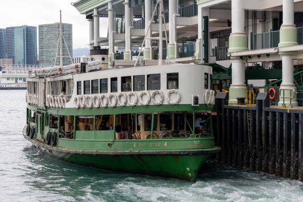 Hong Kong - May 16, 2022 : A Star Ferry at Central Ferry Pier in Hong Kong. The Star Ferry plies its way between Hong Kong Island and Kowloon.