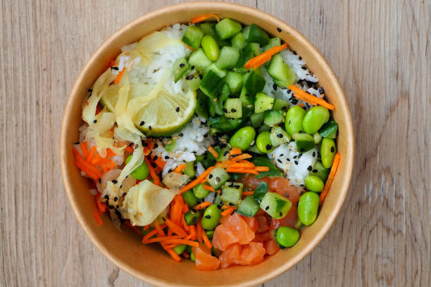 Healthy Japanese poke bowl with edamame beans and sushi rice stock photo