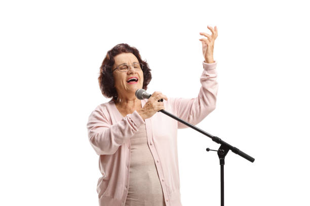 istock Senior woman singing on a microphone 1397535432