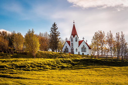 Beautiful white Scandinavian church in Iceland at sunrise