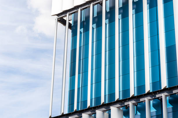 istock The facade of a modern building with an innovative facade made of automatic, movable blinds. 1397537151