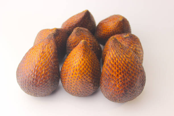 Tropical fruit salak or snake fruit isolated on white background. Fruits Wallpaper. Salak wallpaper. Indonesian fruit