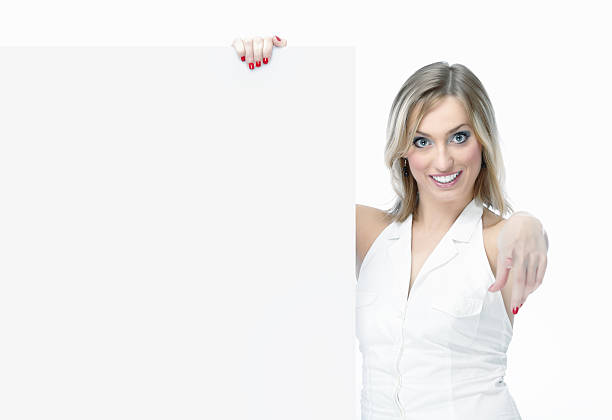 istock Smiling woman holding a blank billboard 139753753