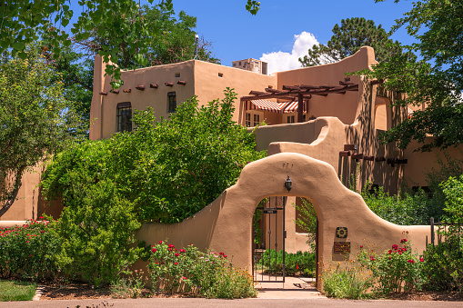 Albuquerque, New Mexico, USA - June 30, 2019: The historic UNM University House dating from 1930. The house is the official home of the university president.