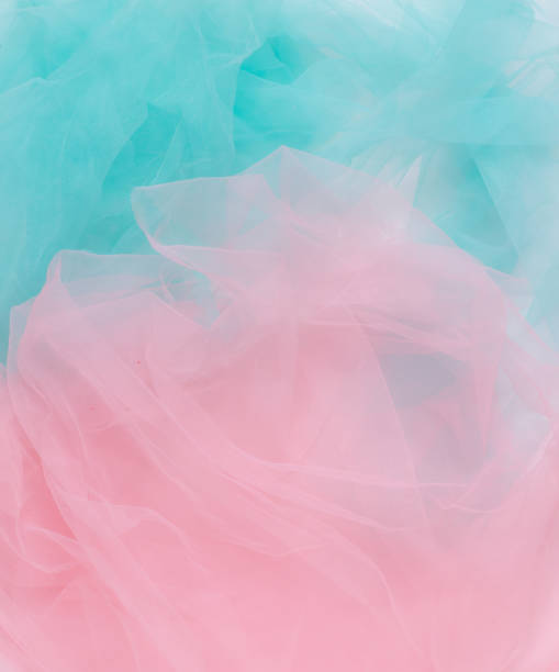 istock Abstract background, pink and blue light wrinkled fabric 1397539682