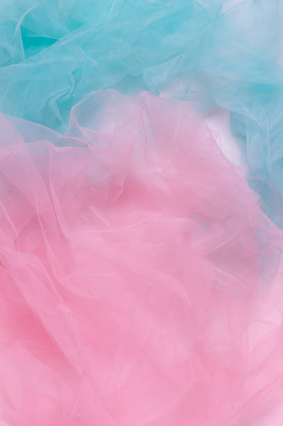 istock Abstract colorful background, pink and blue light wrinkled fabric 1397539708