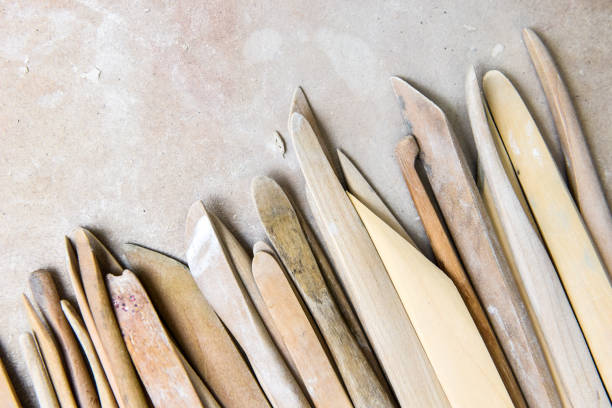 istock Wooden pottery tools set on a ceramics studio background 1397540224