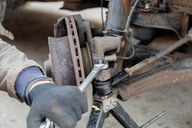 istock car steering repair, steering tips installation. 1397541121
