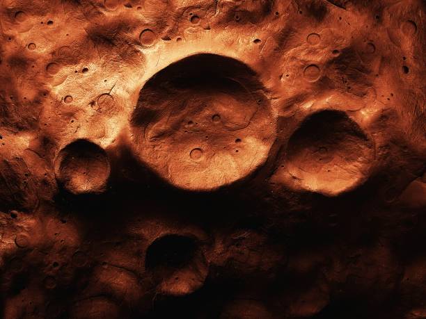 Surface of Mars with craters, large craters on the surface of the rocky red planet. Martian landscape.