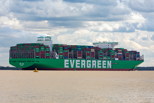 Stade, Germany – May 12, 2022: EVER ARM, the latest ship built for Evergreen Marine Corp on Elbe river heading to Hamburg. As of today, it is world's largest container vessel.
