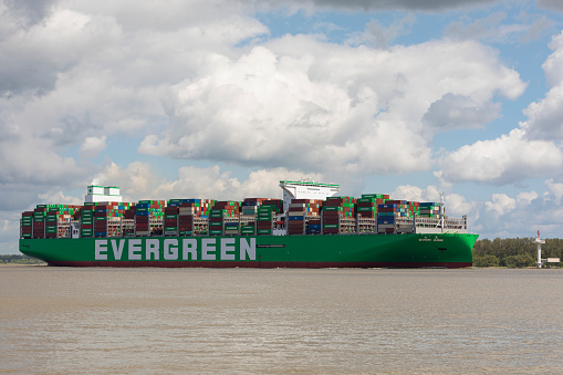 Stade, Germany – May 12, 2022: EVER ARM, the latest ship built for Evergreen Marine Corp on Elbe river heading to Hamburg. As of today, it is world's largest container vessel.