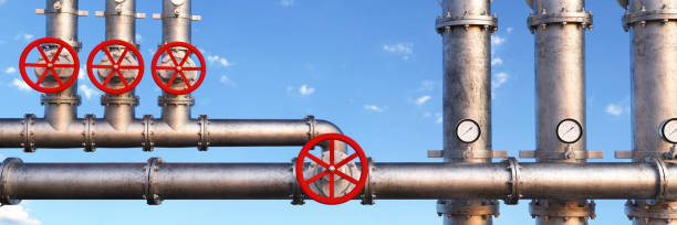 istock Oil pipeline red valves at a refinery 3d render 1397544089