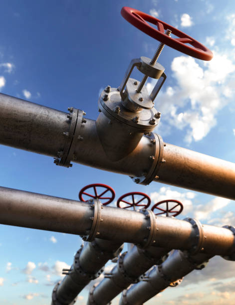istock Oil pipeline red valves at a refinery 3d render 1397544872