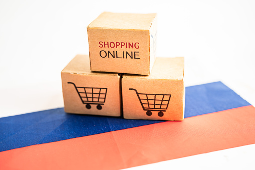 Box with shopping online cart logo and Russia flag, Import Export Shopping online or commerce finance delivery service store product shipping, trade, supplier concept.