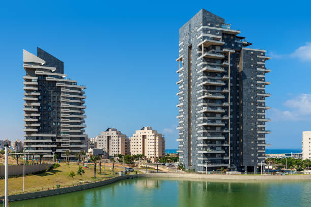 Modern residential building under blue sky in Ashdod, Israel.